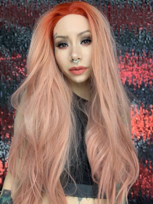 Peach long wavy lace front wig. Peach Melba takes on an unusual colour. Pretty pastel peachy lengths with a pop of orange red colour at the roots.