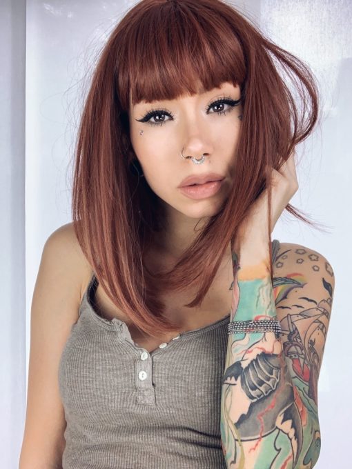 Saffron is a natural granulated cut. A mixture of brunette and cinnamon undertones. A sleek long bob with a blunt fringe. A combination of stylish and sassy.