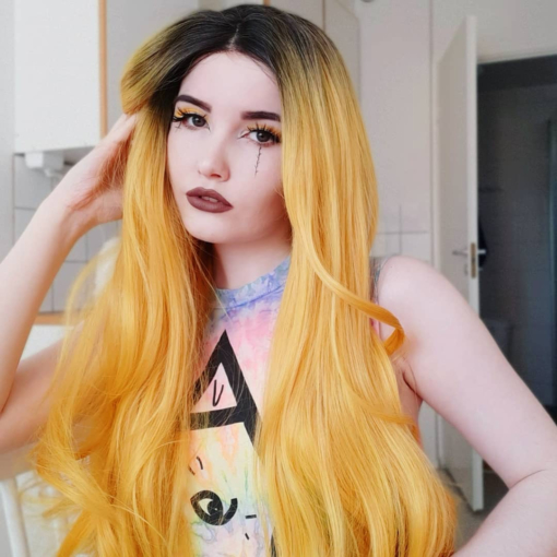 Yellow long straight lace front wig. Sunflower is Bold and beautiful. With cool black shadow roots that blend into a striking yellow blonde shade. 