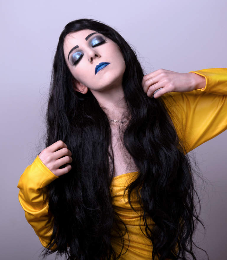 Apparition - Lush Wigs UK A very dark brown colour from roots to tips. Styled in loose waves that fall to the waist. Long invisible layers to add body and movement to the look. With a sleek blunt fringe.