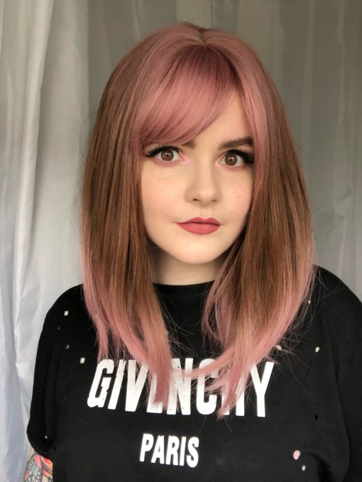 Hana is a sleek long bob (lob). We love the play on colour, rose pink roots melt into caramel brown with rose pint dip dye. A light-weight fringe carries the pink and frames the face.