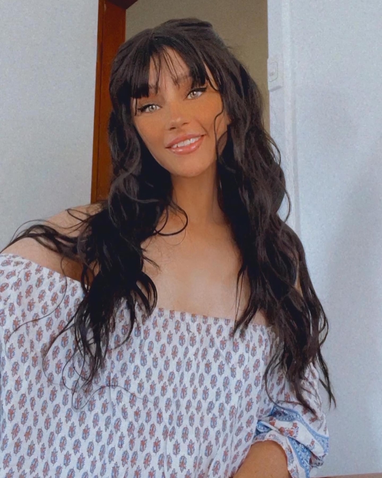 Apparition - Lush Wigs UK A very dark brown colour from roots to tips. Styled in loose waves that fall to the waist. Long invisible layers to add body and movement to the look. With a sleek blunt fringe.