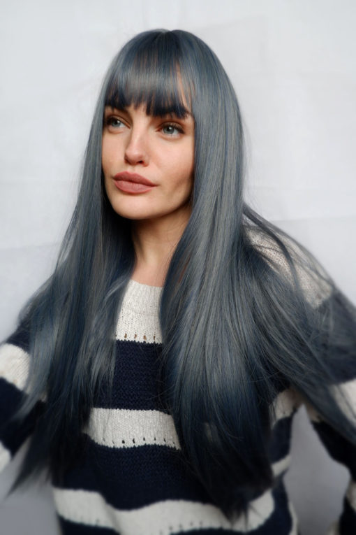 Long straight blue wig with bangs. Be individual and eye-catching style. Poker straight Denim has a greyish and dark blue tone.