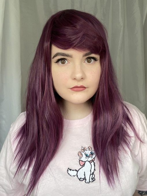 Deep rich purple with a subtle red highlight, Jewel is a perfect gem-toned wig. This one is quite thick, but the style has been broken up with an edgy cut, resulting in choppy ends and a choppy fringe. A closure top brings it together, an easy, bright style. Perfect for beginners!