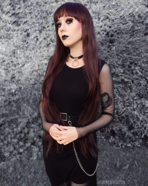 Dark very long straight wig. Be ready to call the corners in Coven. A dark brown hue with burgundy highlights, and long layers for dimension.