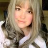 Grey long wig with bangs. Smoke Adds a natural and radiant look. Light sandy tones create this soft look. A delicate wave ends in a large curl at the ends.
