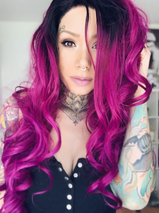 Purple ombre long lace front wig. Beautiful tumbling curls in a bright vibrant purple. Wild berry has black roots that melt in the bright magenta colour.