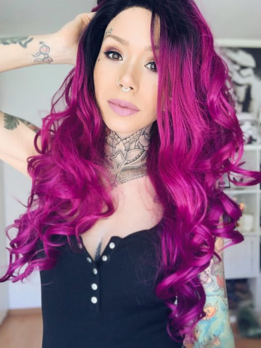 Purple ombre long lace front wig. Beautiful tumbling curls in a bright vibrant purple. Wild berry has black roots that melt in the bright magenta colour.