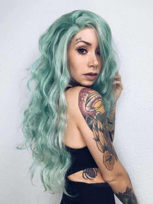 Pastel green long wavy lace front wig. Beachy waves? Check. Topical colour? Check. = perfect mermaid hair! Aileana has pastel green crimped waves.