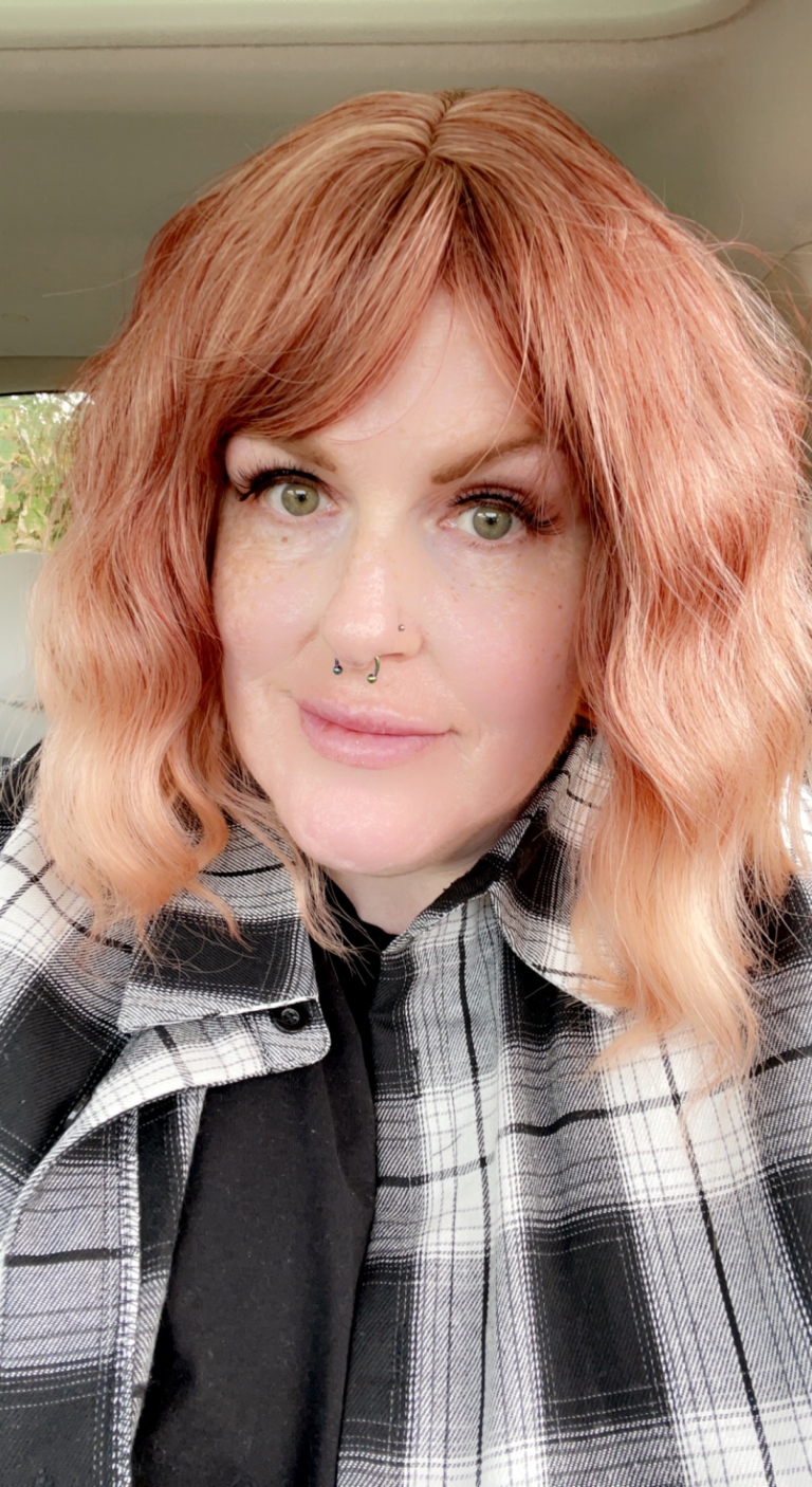 Mara - Lush Wigs UK This bob is a mix of coral and light blonde tones that deliver a beautiful natural ginger hue. With a creamy peach dip dye effect on the ends. The style carries a defined wave that falls just above the shoulders, with a sleek blunt fringe.