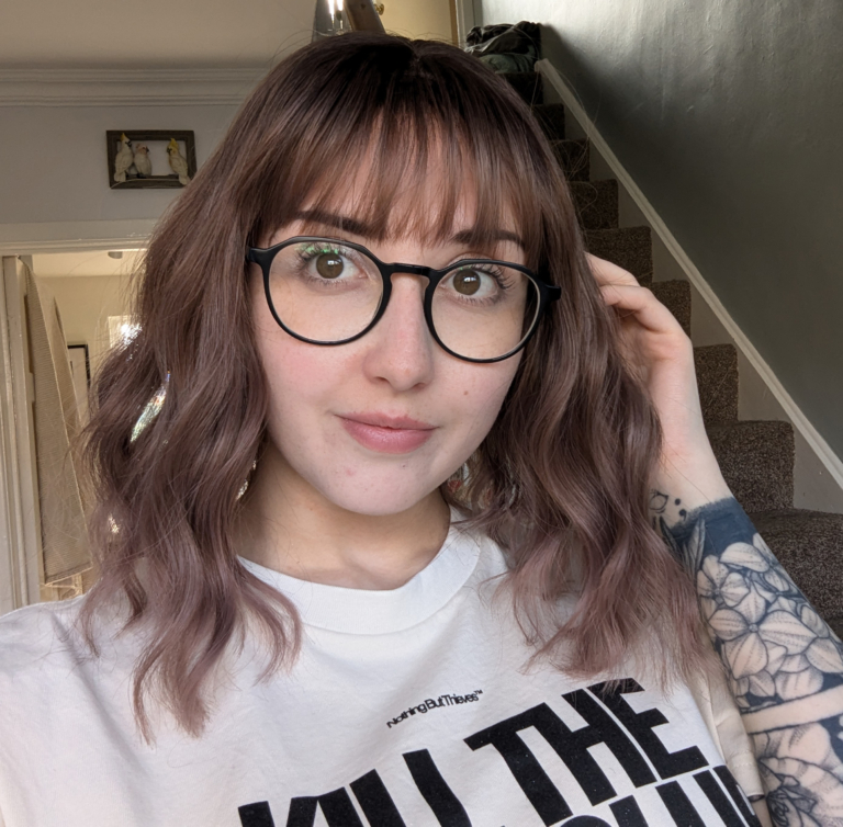 We should let the reviews speak for this one! This natural twist of brown shadowed roots that melt into a muted pink and plum mix ombre. A loose wave bob with a sleek fringe.