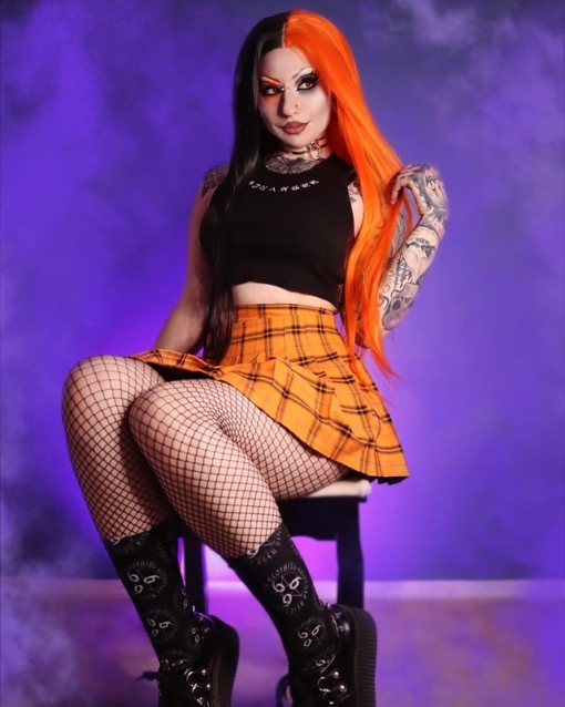 Black and orange split long lace front wig. Kabocha takes on the dramatic colour divide. With its striking black and bright orange colours. Split down the centre and carrying the colours from roots to tips.