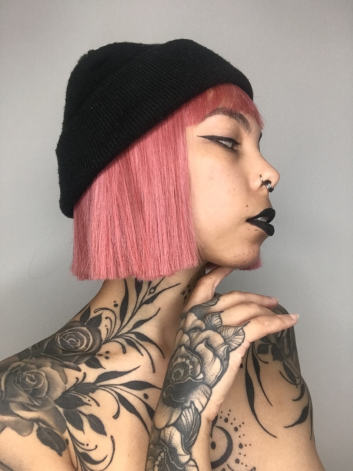 Pink straight bob wig with bangs. Make a statement in this striking style. Fresh rose hues set this poker straight blunt cut.