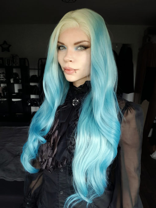 Light blue long wavy lace front wig. Essential for any mermaid look. With pearl blonde roots that blend into a mix of pale blue hues, that reflect tones of coral reefs. Long waist length style with long layers and big barrel brush curls, to add texture and movement. The lengths make it versatile to play with different styles.