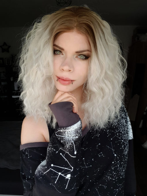 Platinum blonde wavy long bob lace front wig. Stratus is a cute diamond blonde colour, with warm brown overgrown roots. Full of thick crimped waves.
