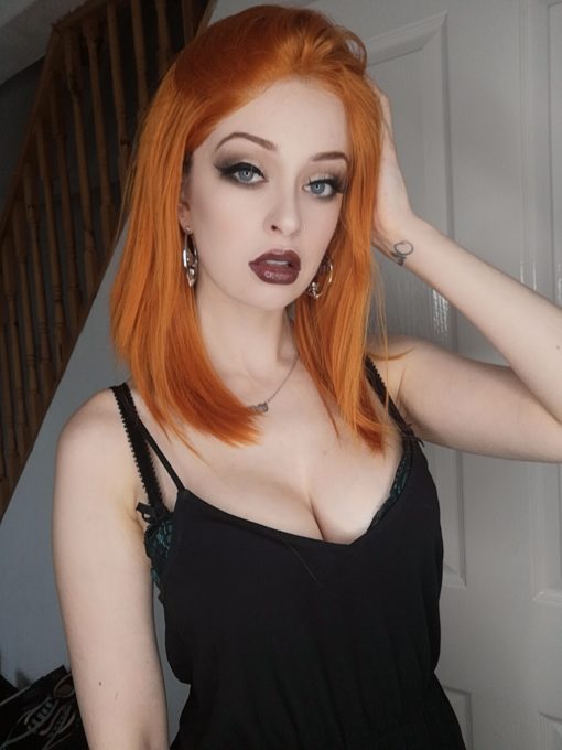 Vibrant orange long bob lace front wig. When the sun goes down, get the look for the night! In this sleek one length poker straight style of bright spiced orange tones. 