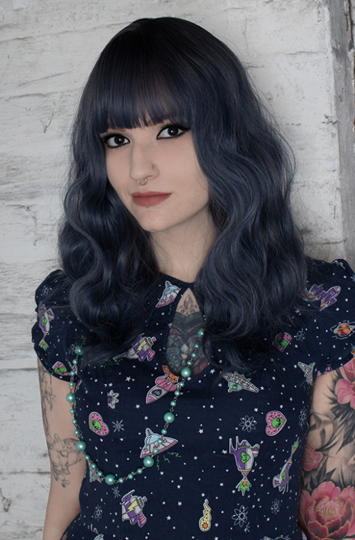 Yugure has a natural twist of brown shadow roots, with a mix of dusky blue and navy hues. Styled in relaxed loose waves for plenty of fullness, falling just past the collarbone Finished with a light fringe.