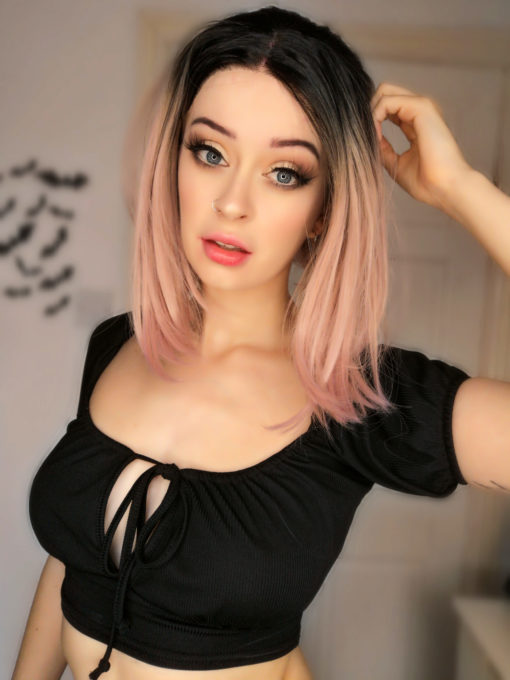 Pink long straight bob lace front wig. This subtle yet eye-catching style with, dark roots that melt into an ombre of pastel pink. A sleek long bob falling to the shoulders. Low maintenance and easy to manage.