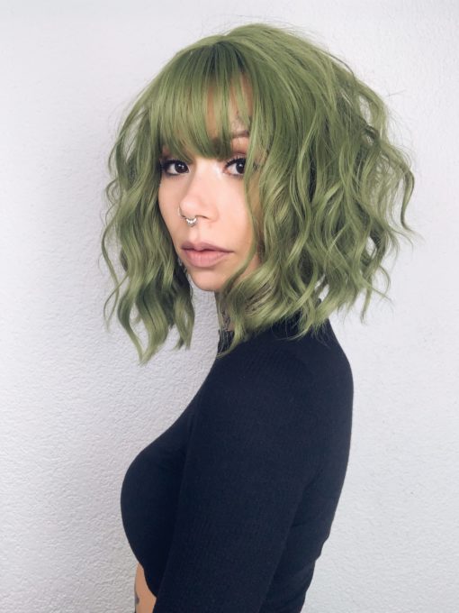 Myre comes in a beautiful jade green colour from roots to tips. Styled in loose waves that fall just below the shoulders. A colourful creation thats easy to wear and maintain.