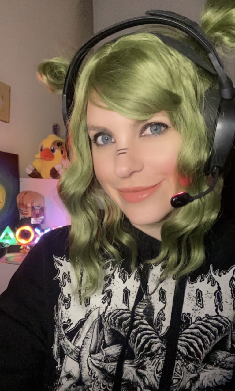 Myre - Lush Wigs UK A bob with a beautiful jade green colour from roots to tips with a blunt sleek fringe. Styled in loose waves that fall just too the shoulders.