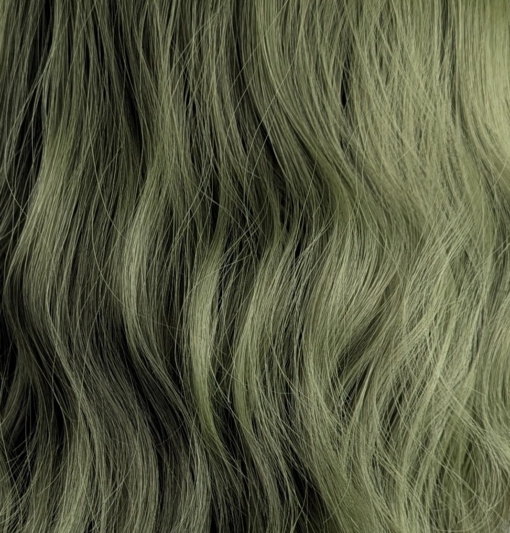 A bob with a beautiful jade green colour from roots to tips with a blunt sleek fringe. Styled in loose waves that fall just too the shoulders.