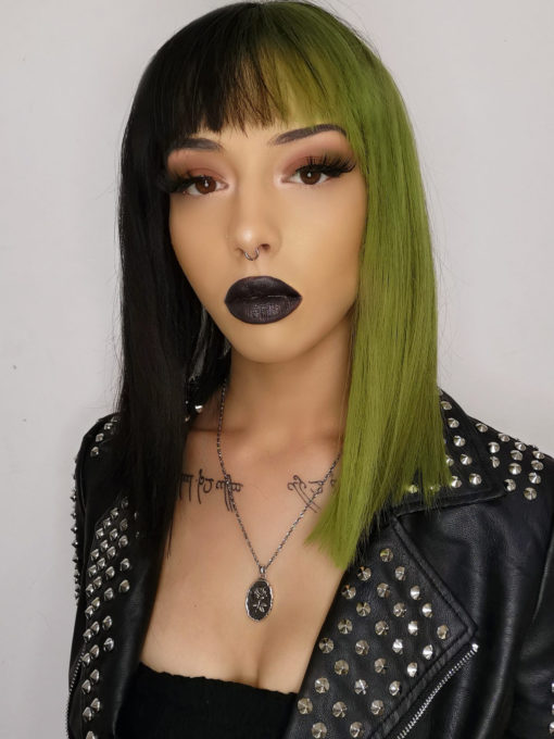 Serpentine takes on the dramatic colour divide. This grungy black and green style. Split down the centre parting and carrying the colour through the fringe.