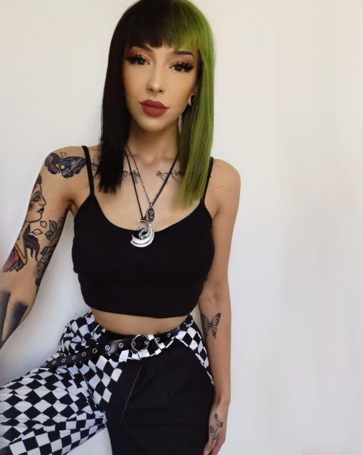 Black and green split long bob wig. Serpentine takes on the dramatic colour divide. This grungy black and green style. Split down the centre parting and carrying the colour through the fringe.