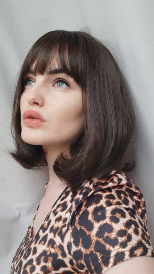 Lilly is a soft and natural warm chestnut tone from roots to tips. A graduated cut that curls under, falling just below the jawline. A simple yet stylish cut that’s easy to maintain.