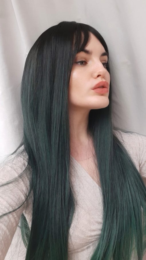 We have iconic gothic vibes with Midori, a barely there twist on colour. Black roots blend into sleek sage ombre. 