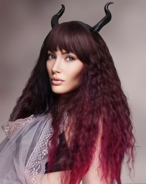 Ruby is a concoction of deep burgundy hues from the roots to a crimson red dip dye on the ends. Think of braids let loose to create volumes of invisible layers and a full fringe to peep from under. Falls just to the waist, add your own individual look with styling and dressing.