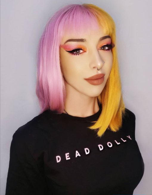 These super cute pastel pink and yellow colours are a fresh take on split colour. Split down the centre parting and carrying the colour through the fringe. Styled straight and sleek.