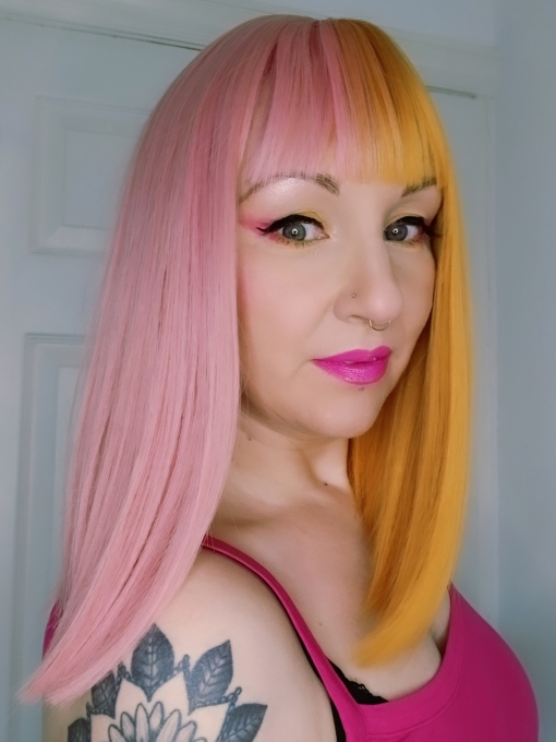 These super cute pastel pink and yellow colours are a fresh take on split colour. Split down the centre parting and carrying the colour through the fringe. Styled straight and sleek.