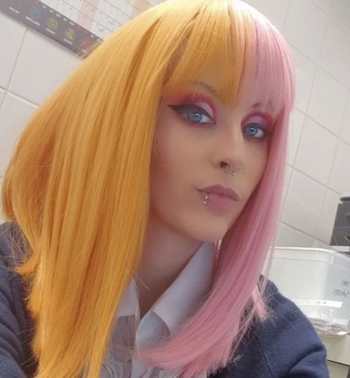 Pink and orange split long bob wig. Popsicle takes on the split colouring technique. These super cute pastel pink and peachy colours. Split down the centre parting and carrying the colour through the fringe. Styled straight and sleek.