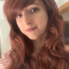 Red long wavy wig with bangs. Fox has a boho feel with its 70s curtain bangs. With deep red auburn waves. Volume at the roots and invisible layers create an illusion of fullness. 