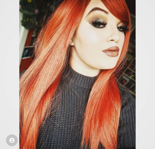 Lava has shades of deep tangerine colour from roots to tips. Long and sleek with invisible layers for extra body and movement. Falling to the waist with a full fringe to frame the face. 