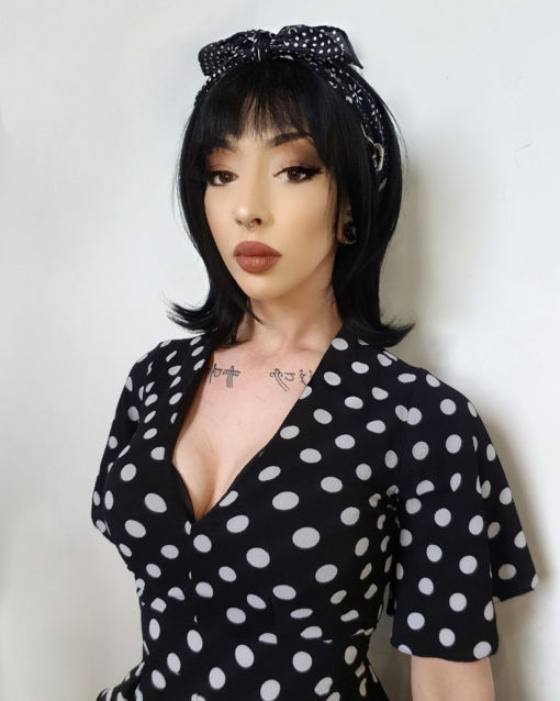 Vintage black bob wig with bangs. Pinup is taking us back to the 60s. This sleek retro style in a natural black colour. finished with that signature 60s flick at the ends.