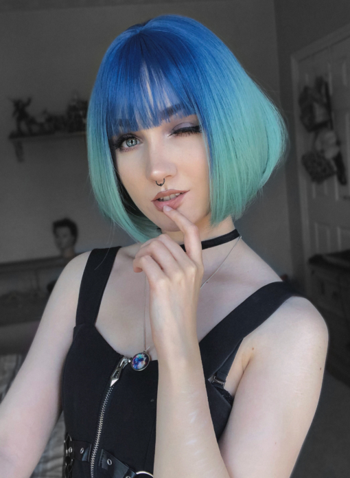 Tide takes to tones of blue, with sky blue roots, meting into an aqua colour. This short sleek bob curls under for body and volume. A light fringe frames the face, manageable and easy to wear. 