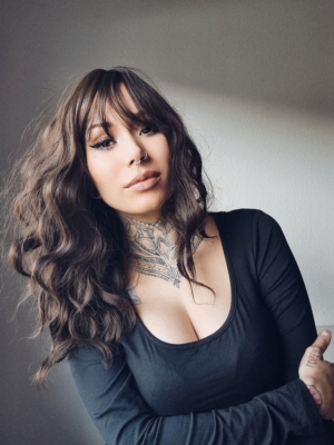 We can’t resist Matsu! This lob is a hit and one of our top trending wigs! The natural light brown shade with textured, tousled, loose curls. With a sleek fringe.