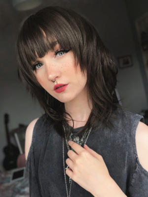 Kosaki takes the lob and turns it on its head. This shaggy sleek cut has body at the crown, with texture and movement around the face. A natural brunette colour.