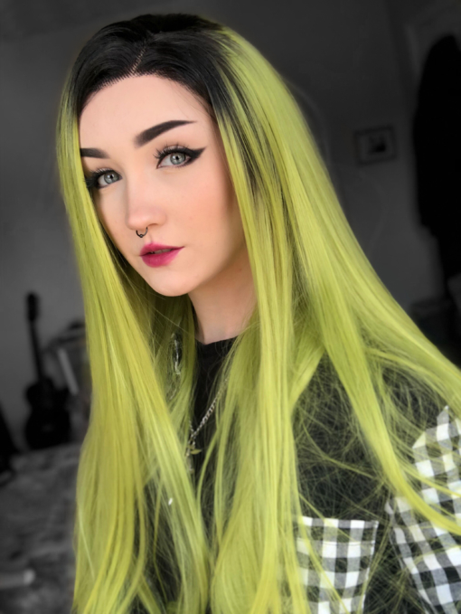 Shamrock is certainly not for the faint hearted! This lime green look has a natural twist of black roots that make this style so bold. Long with barely there waves.
