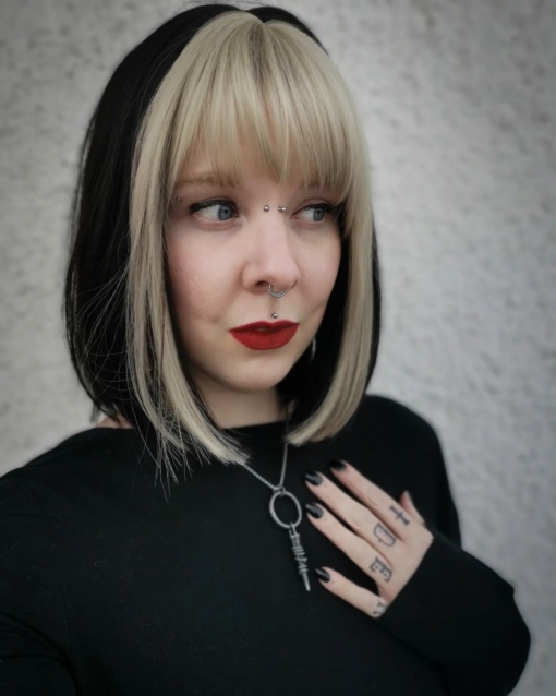 Black/Brown with blonde streak straight bob with bangs. Pika has a distinctive highlight of blonde colour that runs through the fringe and each side of the face. A throwback to the 90s that looks like it's here to stay!