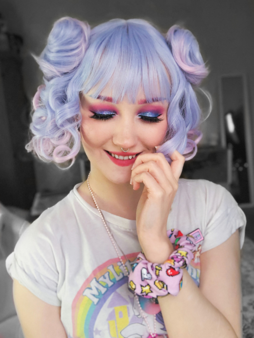 Curly short bob with bangs. Pastel blues and pinks combine to make this cute ringlet delight. This wig comes with two clips in pigtails for extra oomph! Alternatively you can just wear this style alone and let the colours do the talking. A full fringe frames the face.