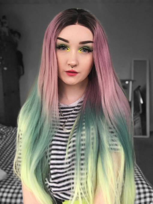 Multicolour lace front wig. Verdi is a colourful creation of dusky deep pink melting into dark teal with a neon green on the ends. The brown shadowed roots give the illusion of a colour that's growing out. A long sleek style that's hard to ignore.
