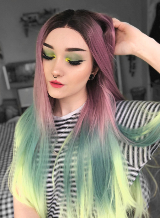 Multicolour lace front wig. Verdi is a colourful creation of dusky deep pink melting into dark teal with a neon green on the ends. The brown shadowed roots give the illusion of a colour that's growing out. A long sleek style that's hard to ignore.