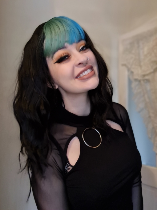 Multi-colour long wavy wig with bangs. Vibrant blue and teal adds a pop of colour to this grungy style. With it's just got out of bed waves. We are loving our collection of bright bangs. 