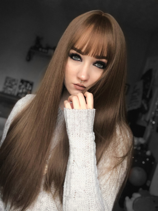Brown straight long wig with bangs. Veronica is a beautiful natural colour of golden brown from roots to tips. A sleek style with long layers at the front with a light fringe.