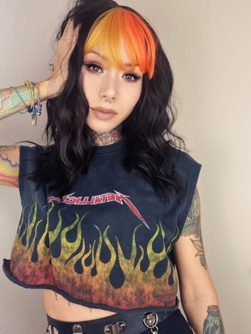 Multi-colour long wavy wig with bangs. Vibrant yellow and orange adds a pop of colour to this grungy style. With it's just got out of bed waves. We are loving our collection of bright bangs. 