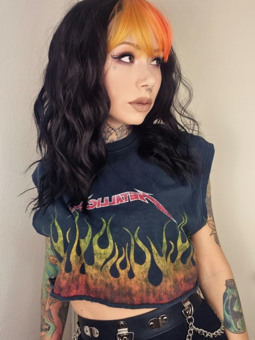 Wildfire has all the warmth of yellow and orange to the bangs on long layers. Black waves with thickness and volume that falls just past the shoulders