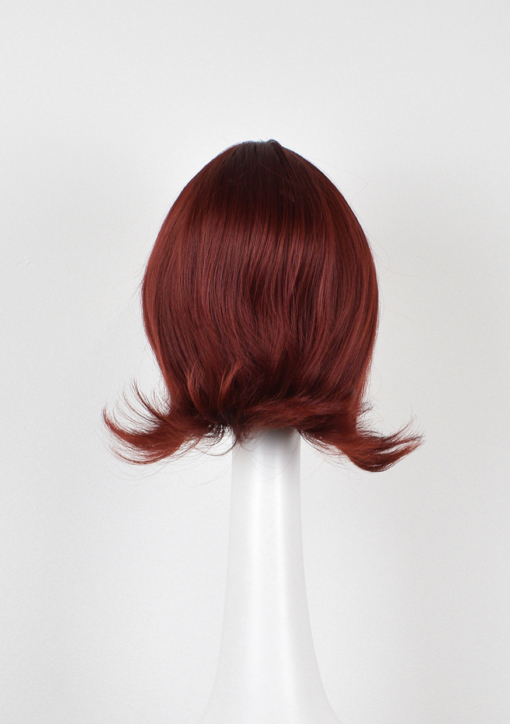 Boop is a sleek cute bob in a dark ruby colour from roots to tips, peaking just below the ears. A light fringe frames the face and a gentle upwards curl for that vintage look.