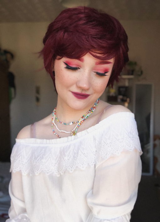 Red short pixie cut wig with bangs. Short and sweet is Cherry, our pixie cut that's hard to ignore with its choppy layers, giving texture and volume to the burgundy red colour. Style for that natural look or mess it up for maximum impact.